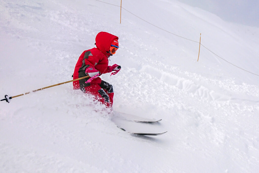 Hedda Rimfors, 8 years-old, tests her first pair of bamboo ski poles at the Sommarstigen off-piste run in Riksgränsen 2020.