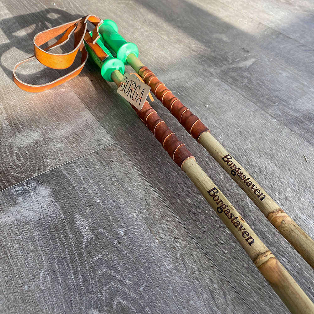 Borga bamboo ski poles with green grips and middle grip of leather.