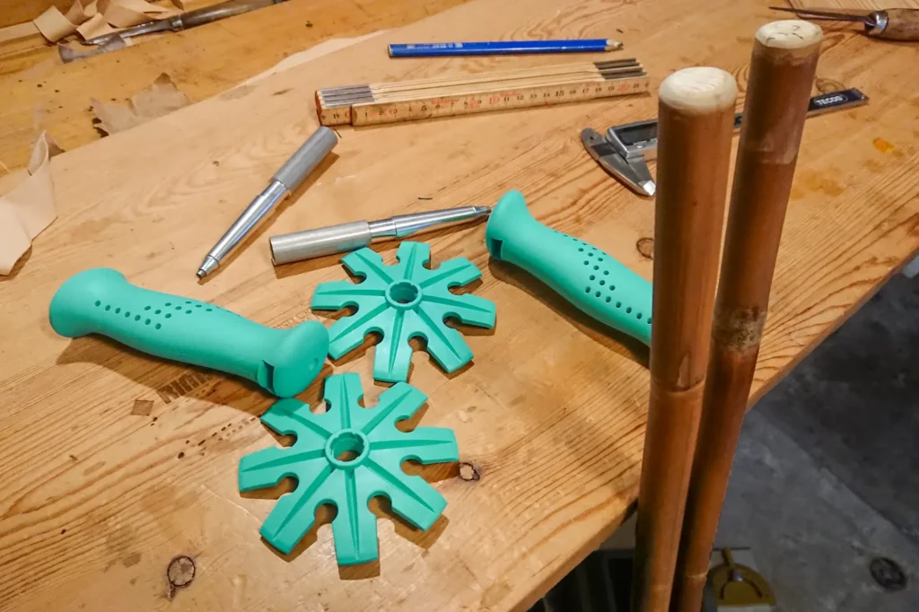 Turquoise baskets and grips will become ski poles together with dark brown Calcutta bamboo.
