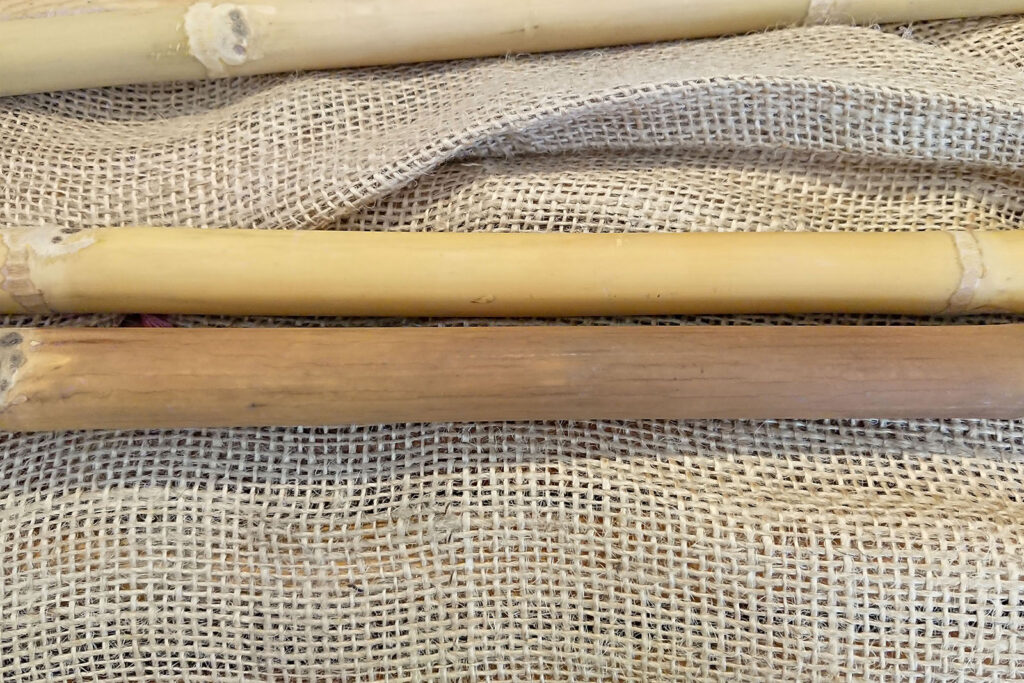 A natural Calcutta bamboo cane above compared to a dark tan cane below.