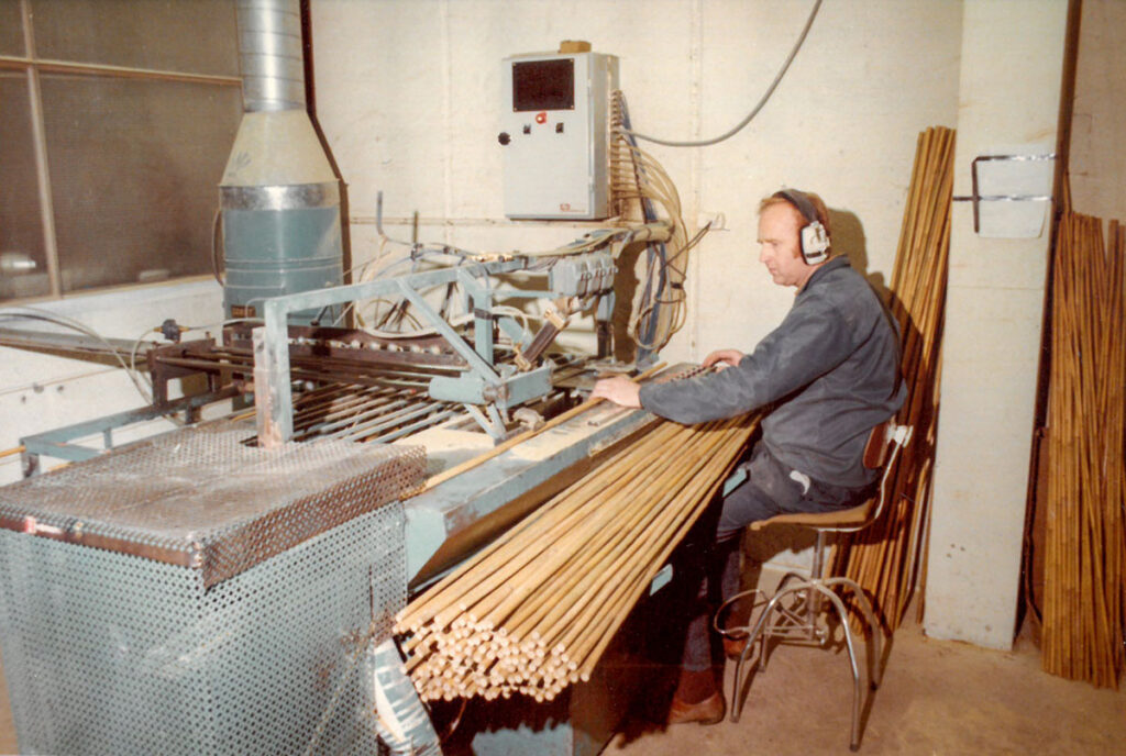 Einar Brukvangen efficiently cuts tonkin bamboo to the correct lengths at Swix/Liljedahl's ski pole factory in Lillehammer, 1976.