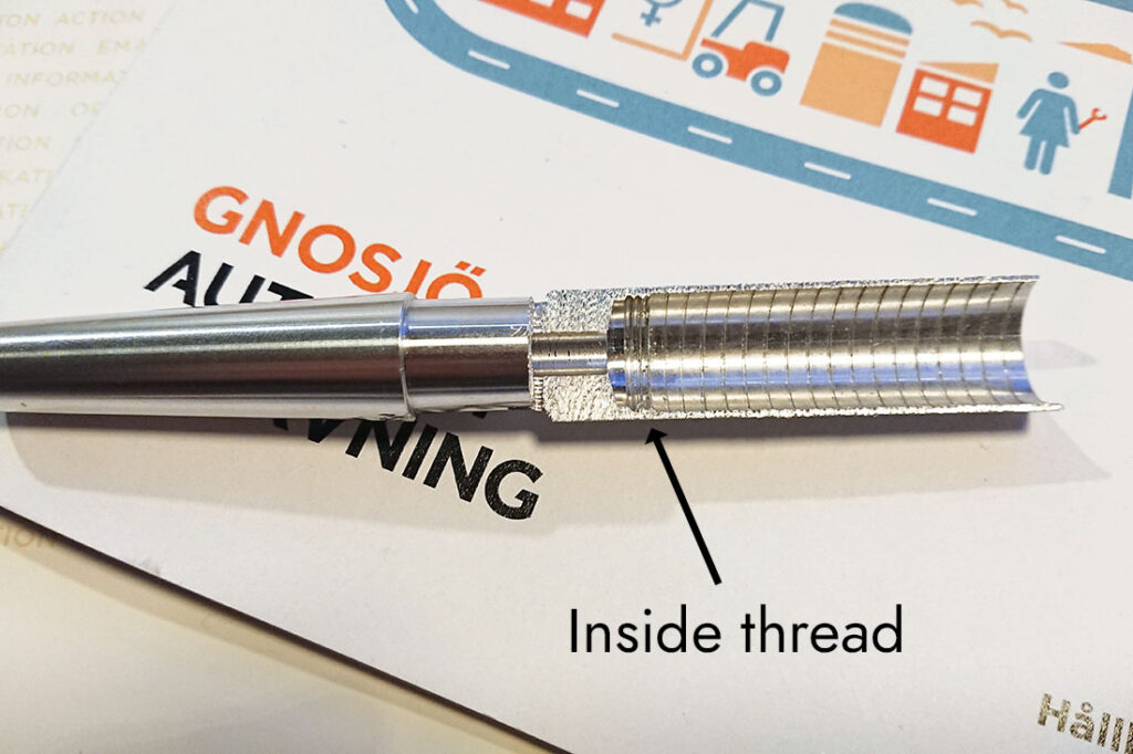 Cross-section photo of the new updated aluminum ferrule . The inside thread is visible in the bottom of the ferrule.