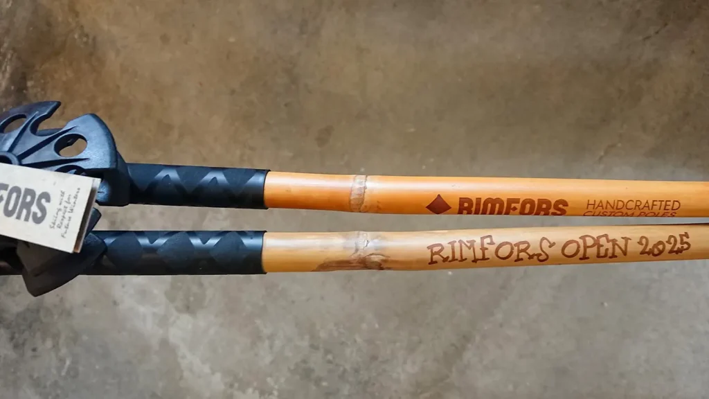 Bamboo ski poles engraved with Rimfors Open 2025.
