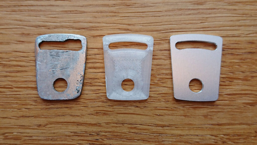 From left: my first self-made prototype from a leftover piece of metal, CAD-printed prototype in plastic, and the final prototype routed in aluminum (also from left-over material).