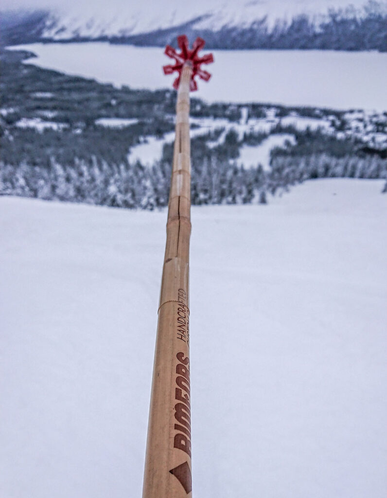 Broken bamboo ski pole fixed with tape to work fine again.