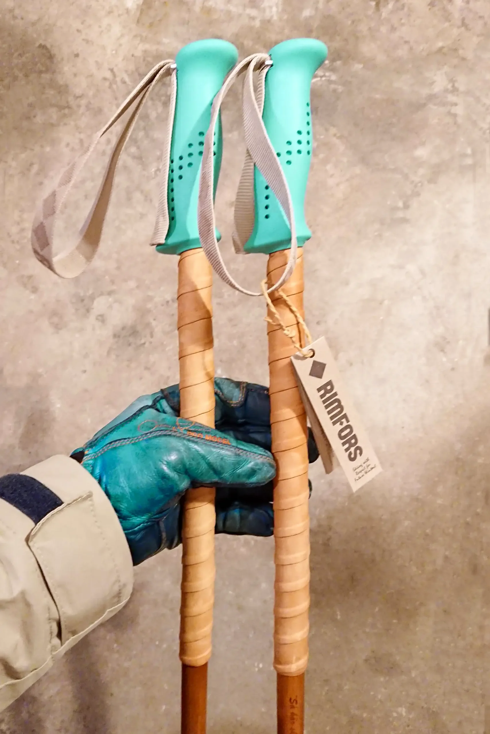 Turquoise bamboo ski poles with grip extensions of reindeer leather and dark tan Calcutta bamboo.
